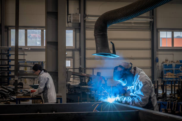 istock Welders working in factory 1443208351
