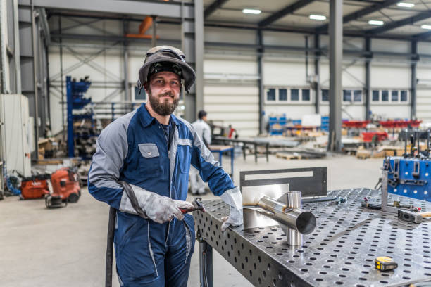 Welder standing in factory