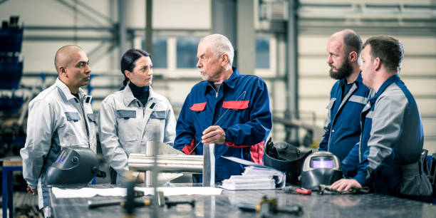 istock Workers discussing in factory 1443208381