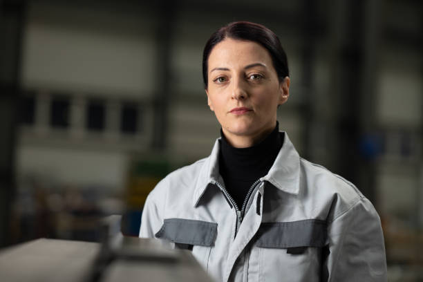 istock Woman standing in factory 1443208391