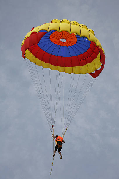 istock Paraglider landing on the beach 144320849