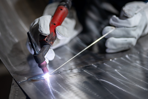 Manual tig welding in an engineering industry.