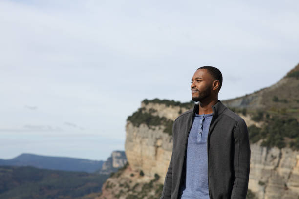 istock Black man contemplating views in the mountain 1443209582