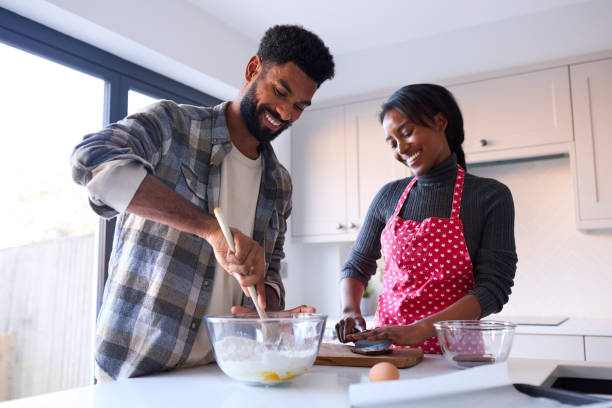 istock Couple At Home Baking Cake Together In Kitchen 1443210007