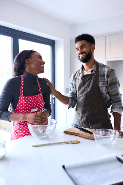 istock Couple At Home Baking Cake Together In Kitchen 1443210172