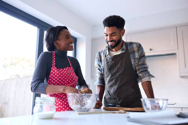 istock Couple At Home Baking Cake Together In Kitchen 1443210230