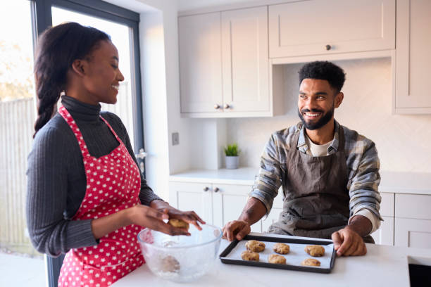 istock Couple At Home Baking Cookies Together In Kitchen 1443210294