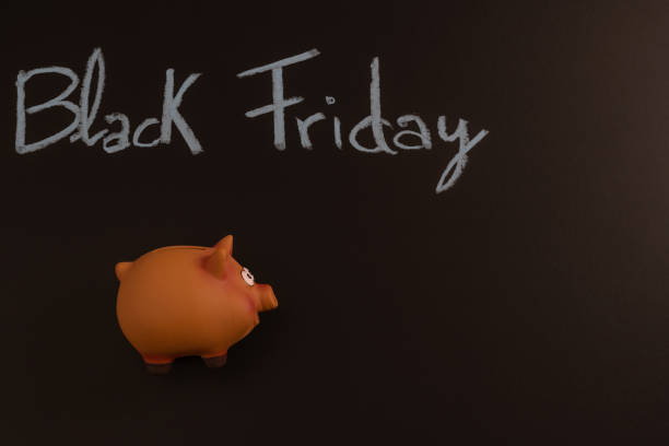 istock funny piggy bank for saving on purchases with Black Friday text 1443210861