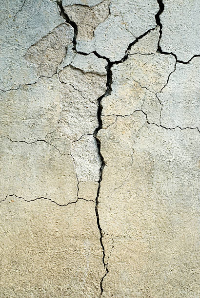 istock Close-up of cracked gray concrete 144321116