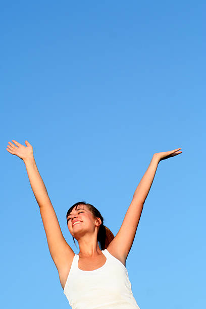 istock Woman spreading arms to sky 144321154