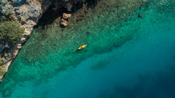 istock People kayaking clear turquoise sea 1443211784