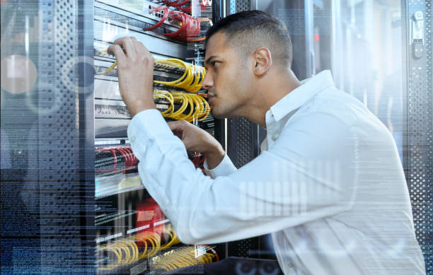 istock Data center, IT technician and man in server room for 404 error, glitch and cybersecurity with cables for motherboard maintenance and assessment. Engineer working on connection for digital network 1443215069