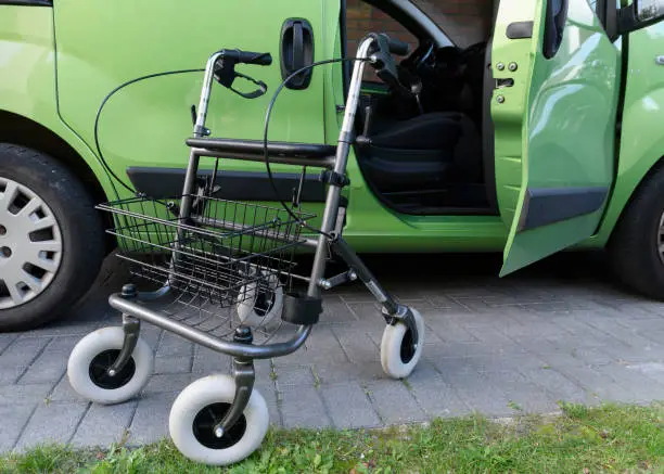 Rollator Walker outside when used to get into the passenger seat of a car
