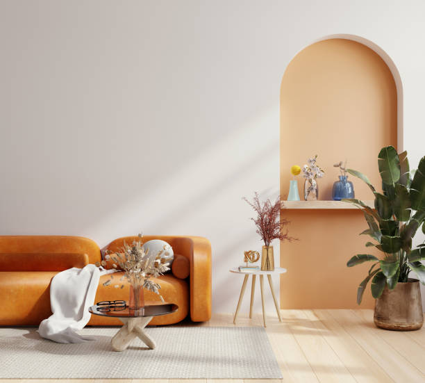 istock Simple minimal Nordic style interior with orange leather sofa and decoration minimal on two tone wall. 1443216536
