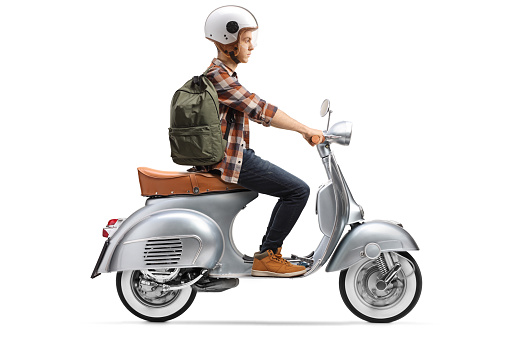 Male student with a helmet riding a scooter isolated on white background