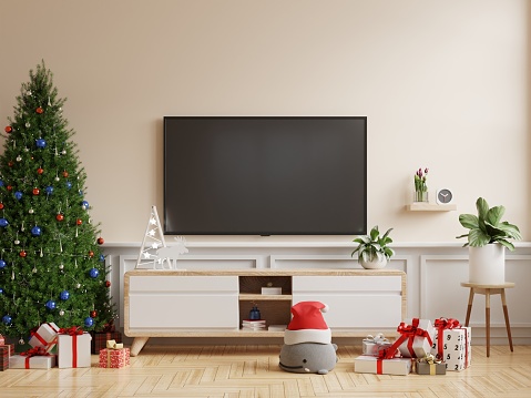 Christmas room with TV cabinet in modern living room on cream wall background.3d rendering