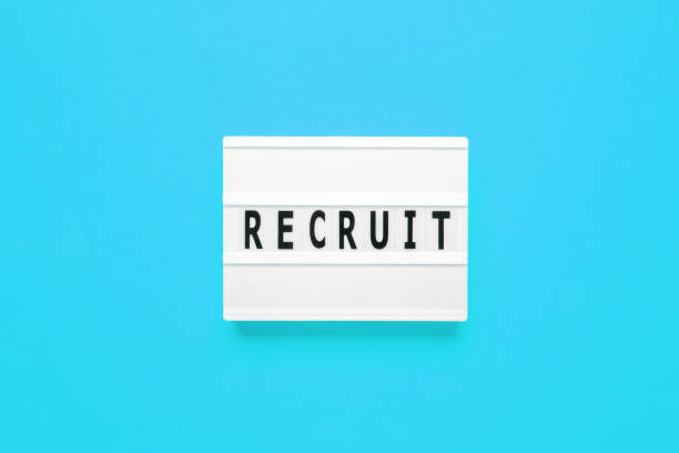 istock Lightbox with word recruit on lihgt blue background, searching for people, recruitment concept 1443216977