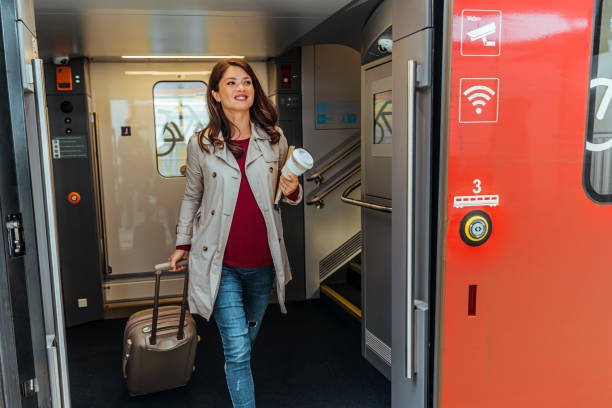 istock Young business woman leaving the train 1443217162