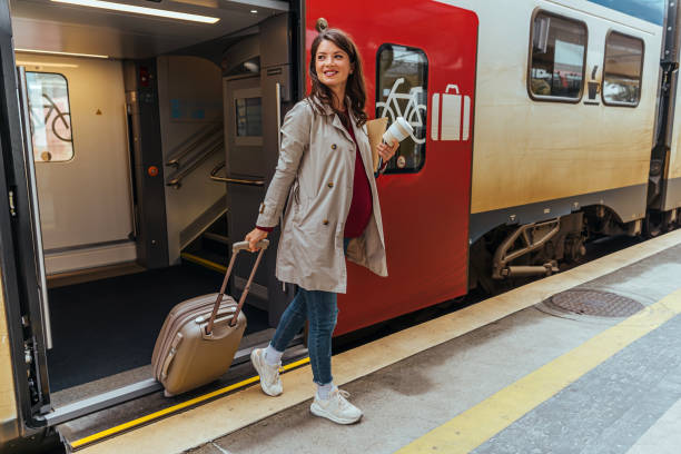 istock Business woman commuter walking in a train station 1443217214