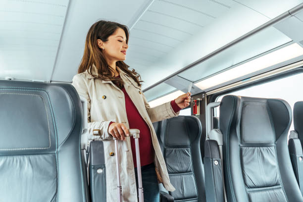 istock Woman on the train holding train ticket. 1443218273