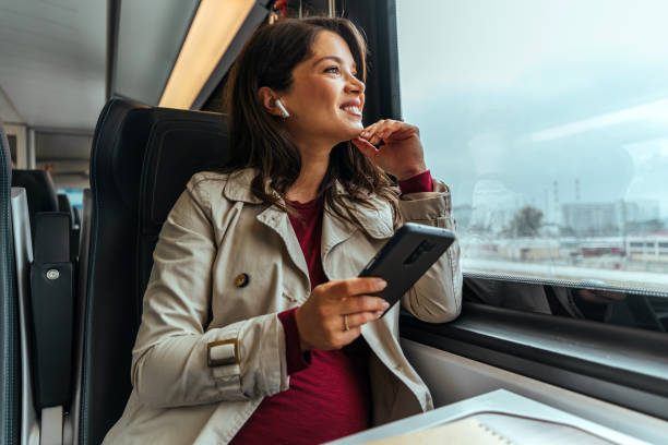 Businesswoman on the move taking public transportation