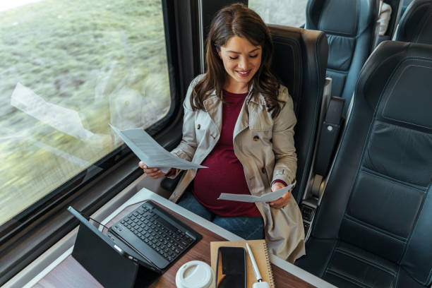 istock Pregnant woman at home checking her mail 1443218754