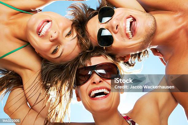 Friends In A Huddle Stock Photo - Download Image Now - 20-24 Years, Adult, Adults Only