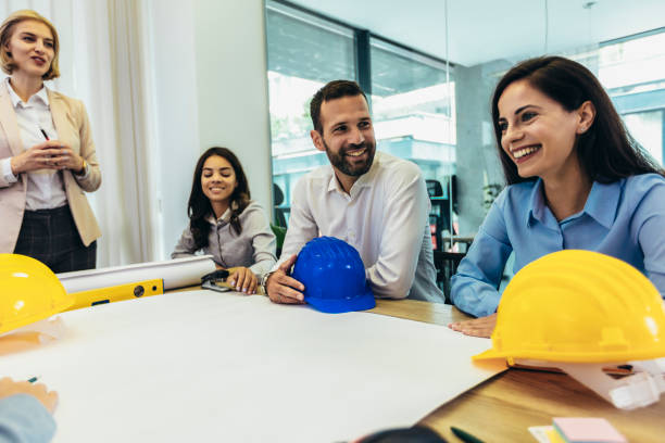 istock Architects, designers and engineers having working meeting in modern office 1443220675