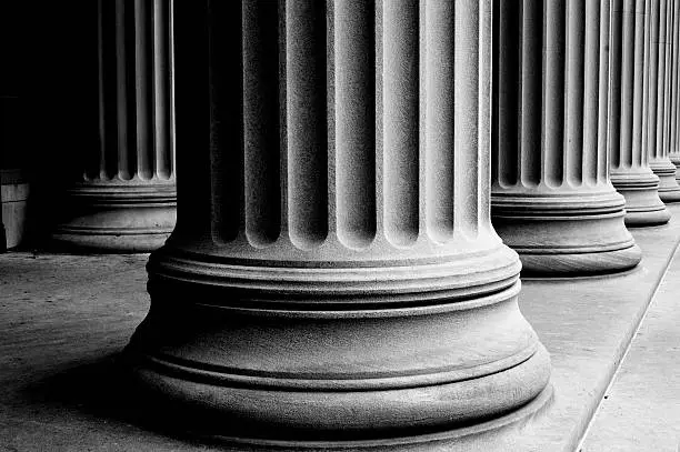 close-up of classic columns in black and white