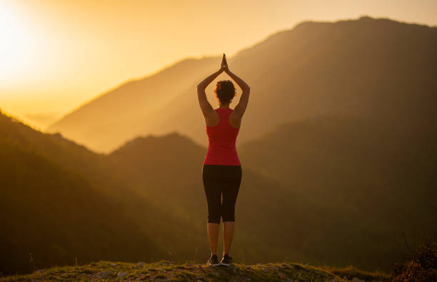 woman doing yoga asanas and poses in nature.