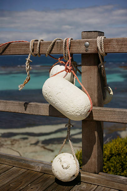 Bouys Tied Up On A Jetty stock photo