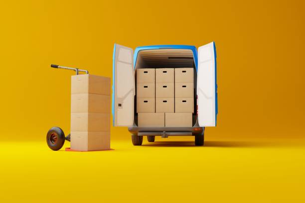 istock Commercial delivery white van with cardboard boxes on yellow background. 1443225610