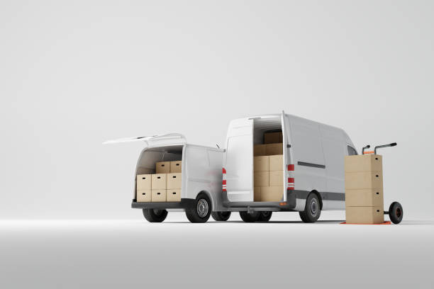 istock Two commercial delivery white vans with cardboard boxes on white background. 1443226182