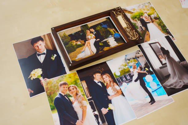 istock printed wedding photos and a wooden box with a flash drive. 1443227255