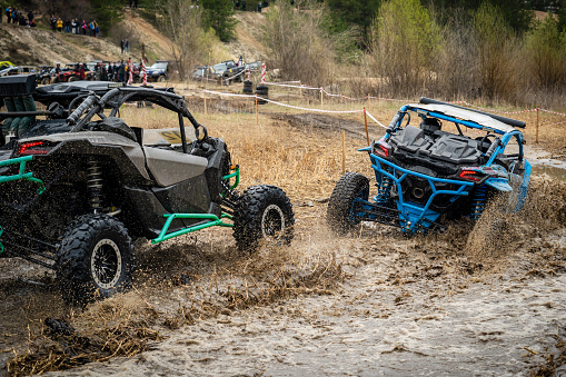 Atv vehicles in muddy water at the quad (buggy) competition