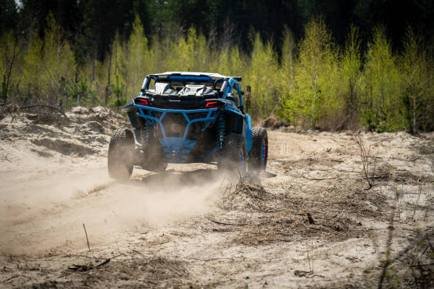 istock Summer UTV, ATV & offroad driving in dust. Quad racing 1443230070