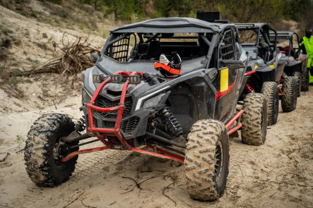 istock Cool quads stand in a row on sand before competition 1443230147
