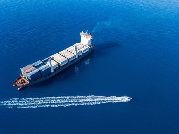 istock Aerial view on boat and container ship. Shipping cargo. Export, import and logistic 1443230164