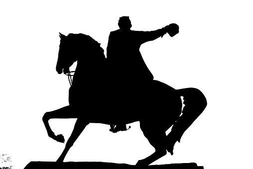 black and white statue of a man on a horse