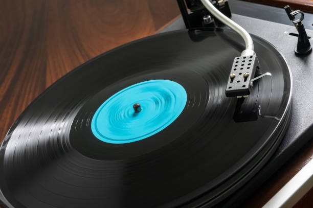 istock Record player, vinyl turntable record player, while playing the record. Close-up LP record with blue label 1443230946