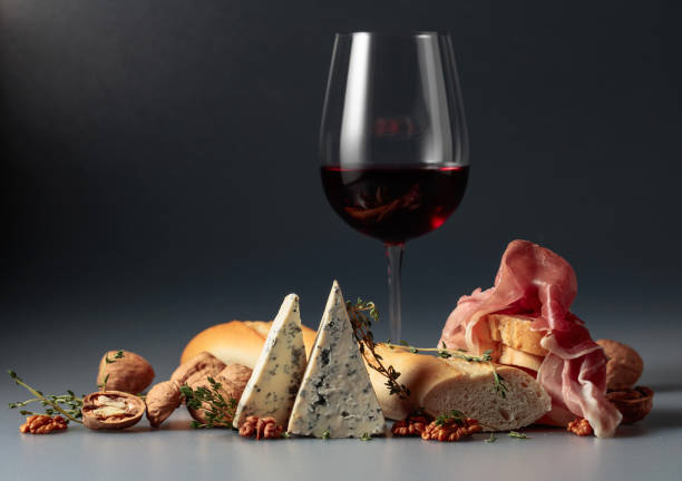 Red wine with traditional Mediterranean snacks. stock photo
