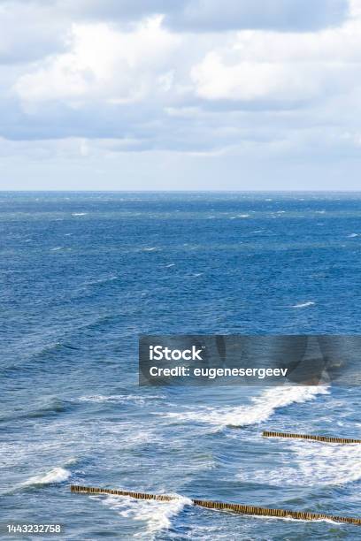Baltic Sea View With Breakwaters Under Cloudy Sky Stock Photo - Download Image Now - Backgrounds, Baltic Countries, Baltic Sea