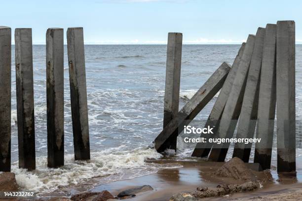 Concrete Pillars As A Part Of Broken Breakwater Structure Stock Photo - Download Image Now