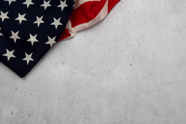istock united states flag in upper left corner on concrete background 1443233580