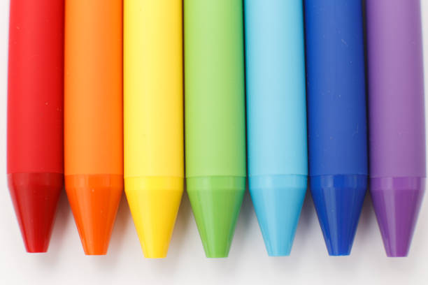Multicolored in rainbow colors gel pens isolated on a white background, close-up. Copy space.