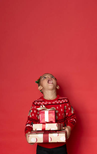 istock Small boy have a fun on Christmas photo shoot. 1443234584