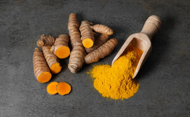 istock Turmeric Powder And Sliced Turmeric Root 1443237445