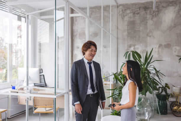 istock Manager Talking With A Female Finance Advisor In The Office 1443237778