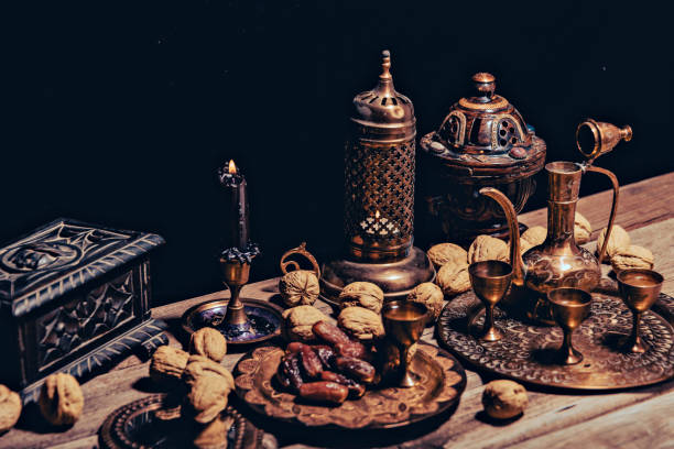 istock Persian Tea and teapots pouring hot tea in tea cups at a table. 1443238185