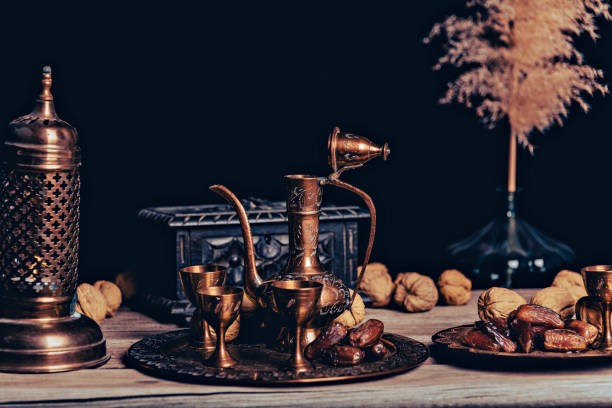 istock Persian Tea and teapots pouring hot tea in tea cups at a table. 1443238196